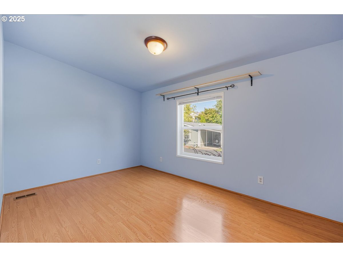 1819 Southeast Orient Drive, Unit 1 Gresham, OR 97080 - Photo 19 of 31 a view of an empty room with a window