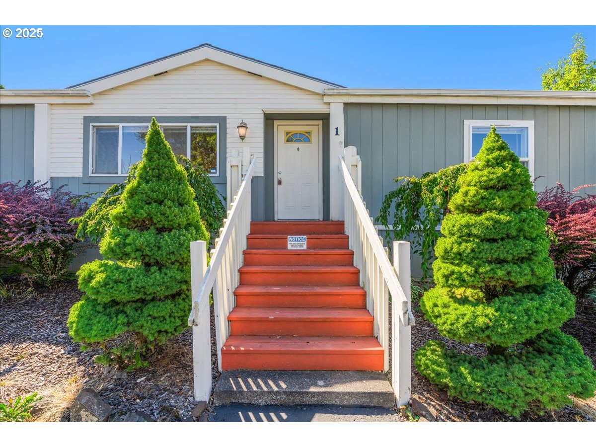 1819 Southeast Orient Drive, Unit 1 Gresham, OR 97080 - Photo 2 of 31 a view of a house with a yard