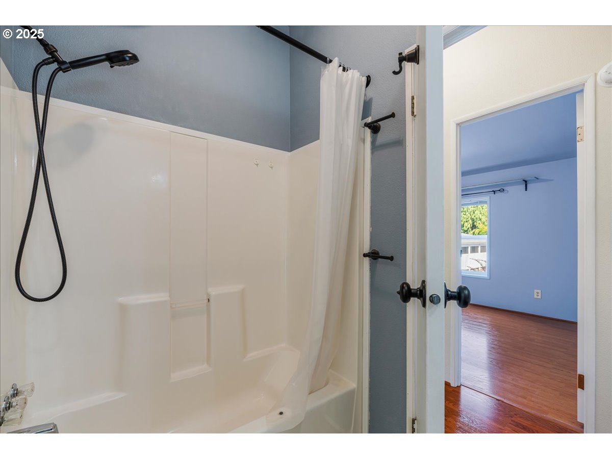 1819 Southeast Orient Drive, Unit 1 Gresham, OR 97080 - Photo 27 of 31 a bathroom with a shower