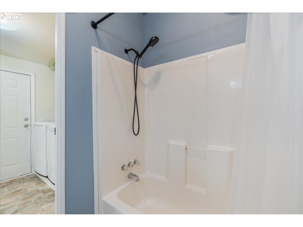 1819 Southeast Orient Drive, Unit 1 Gresham, OR 97080 - Photo 28 of 31 a bathroom with a shower