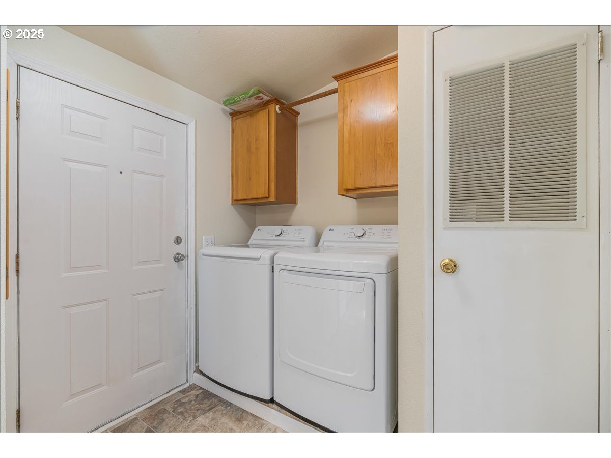 1819 Southeast Orient Drive, Unit 1 Gresham, OR 97080 - Photo 29 of 31 a bathroom with a sink and a mirror