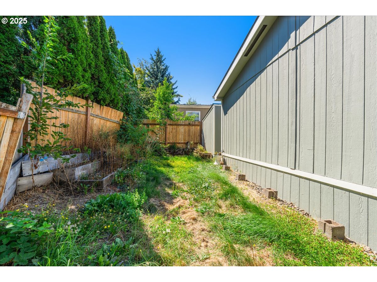 1819 Southeast Orient Drive, Unit 1 Gresham, OR 97080 - Photo 30 of 31 a view of a backyard with potted plants