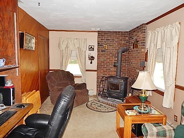 12 Gerard Avenue Freetown, MA 02717 - Photo 13 of 30 a living room with furniture and a fireplace