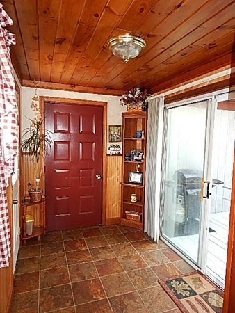 12 Gerard Avenue Freetown, MA 02717 - Photo 20 of 30 a view of an empty room with a glass door
