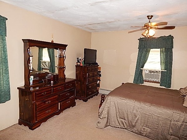 12 Gerard Avenue Freetown, MA 02717 - Photo 24 of 30 a bedroom with a bed and wooden floor