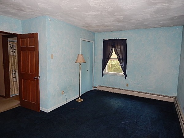 12 Gerard Avenue Freetown, MA 02717 - Photo 26 of 30 an empty room with wooden floor cabinet and closet