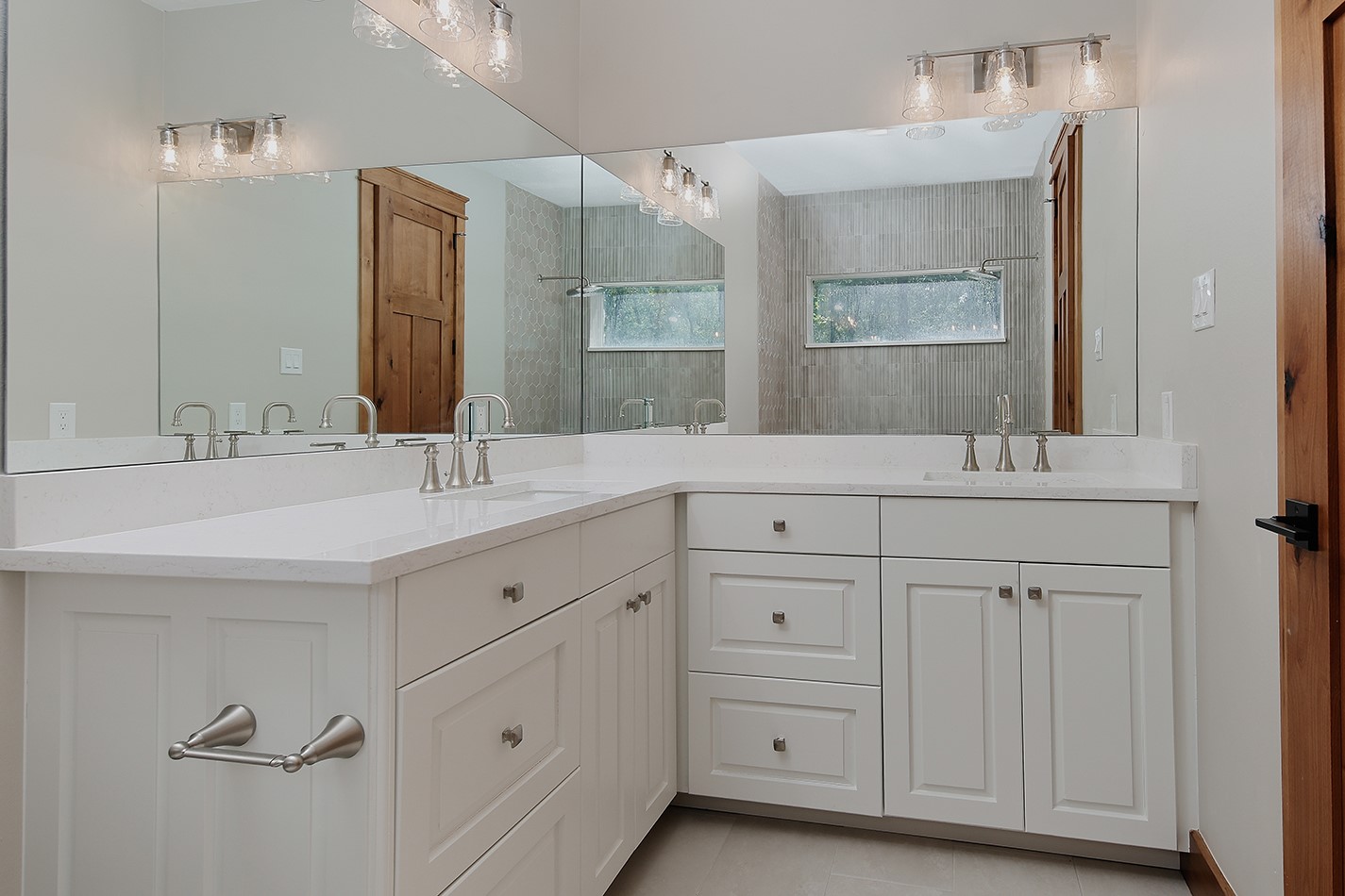 26442 McDonald Road Spring, TX 77380 - Photo 32 of 50 Primary ensuite bath 2 is attractive with pleasing colors/finishes. Custom dual vanities with modern plumbing/lighting fixtures have upscale quartz counters, and custom shower is stunningly beautiful.