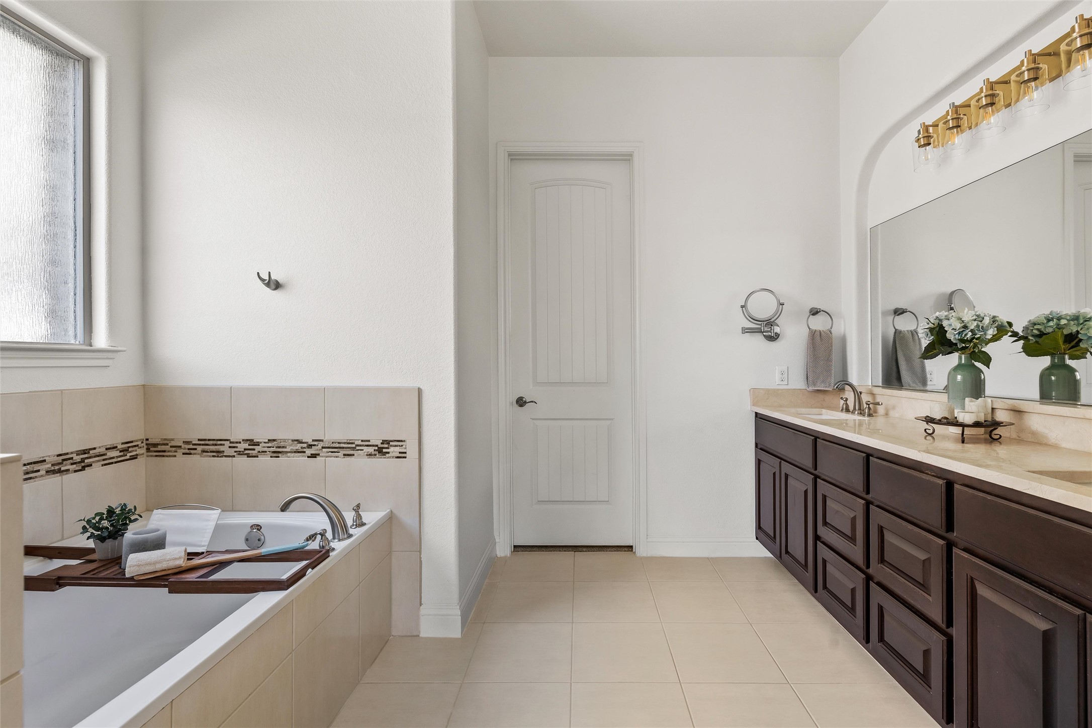 151 Swallowtail Drive Austin, TX 78737 - Photo 15 of 40 a bathroom with a tub sink and mirror