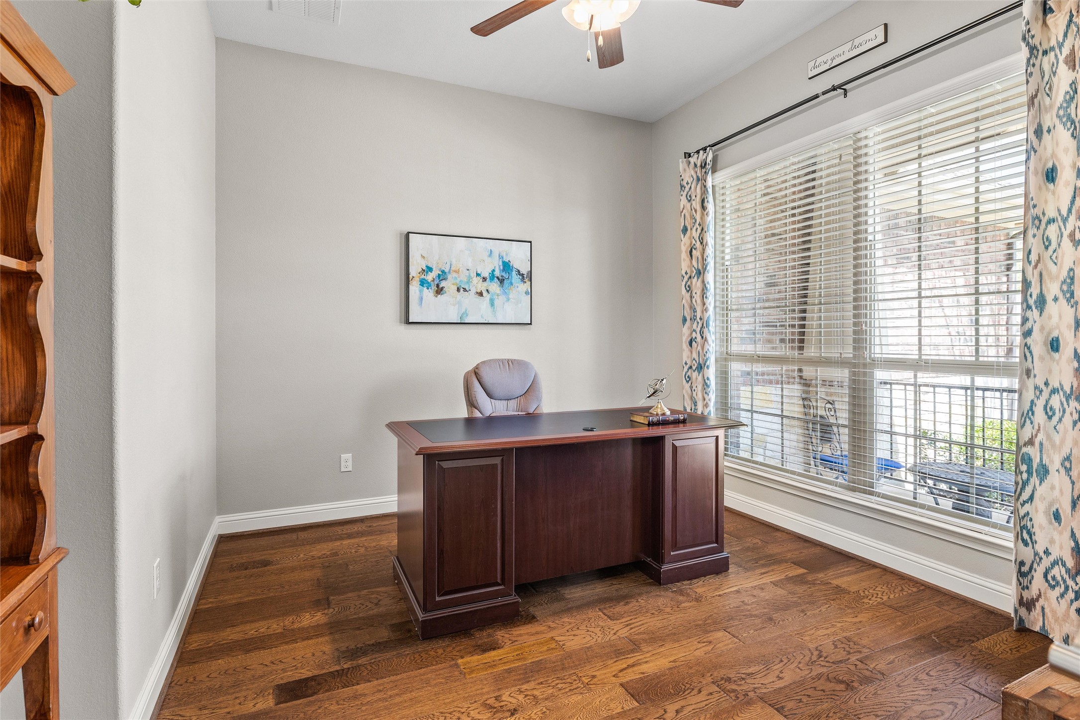 151 Swallowtail Drive Austin, TX 78737 - Photo 17 of 40 a view of workspace with wooden floor and window