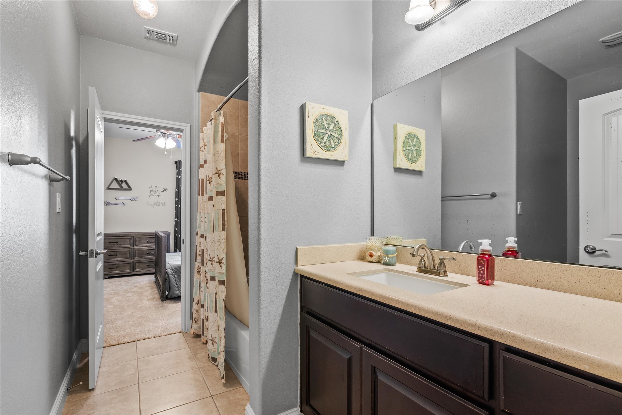 151 Swallowtail Drive Austin, TX 78737 - Photo 22 of 40 a bathroom with a sink and a mirror