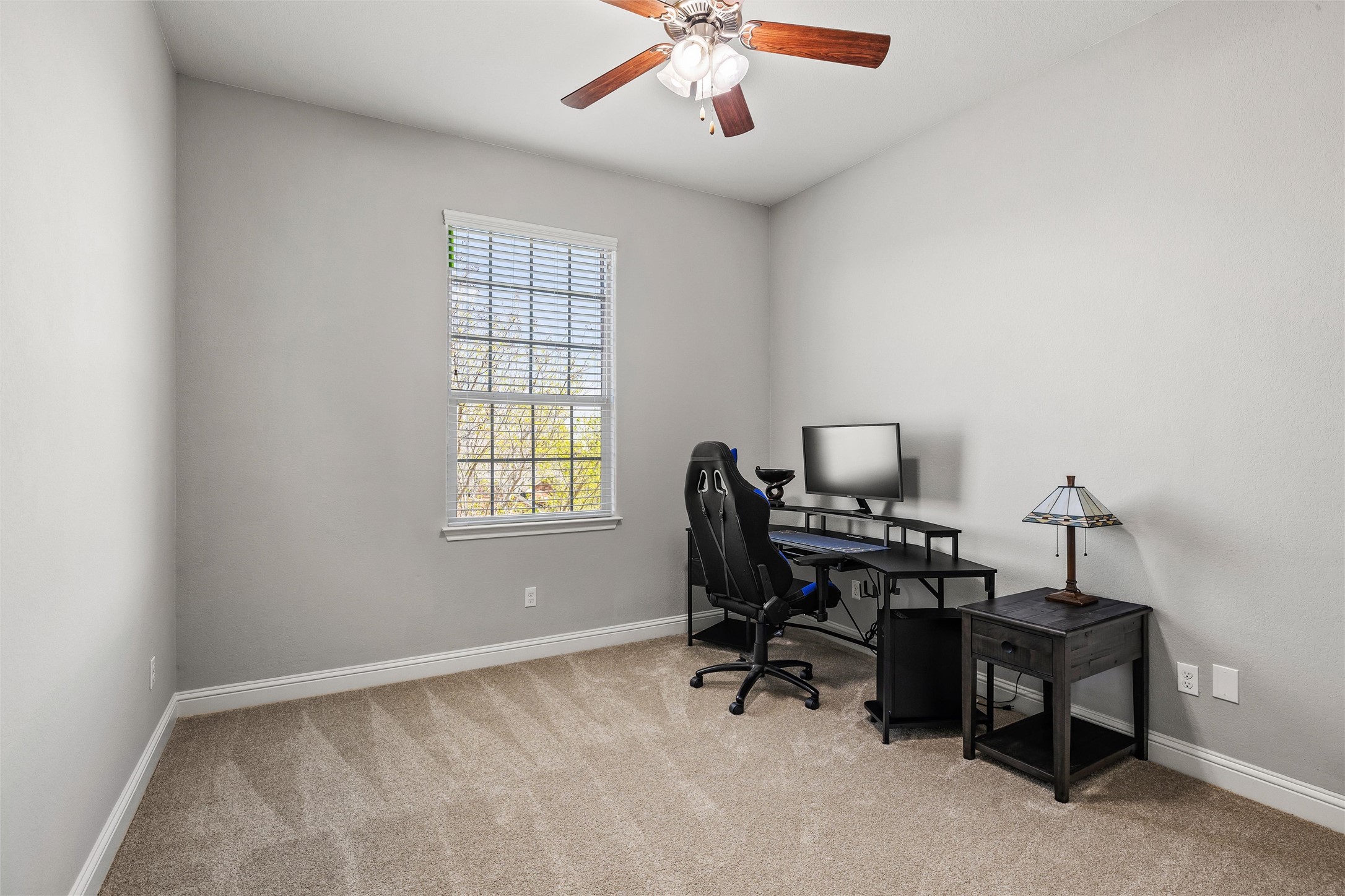 151 Swallowtail Drive Austin, TX 78737 - Photo 23 of 40 a view of a workspace with furniture and a window