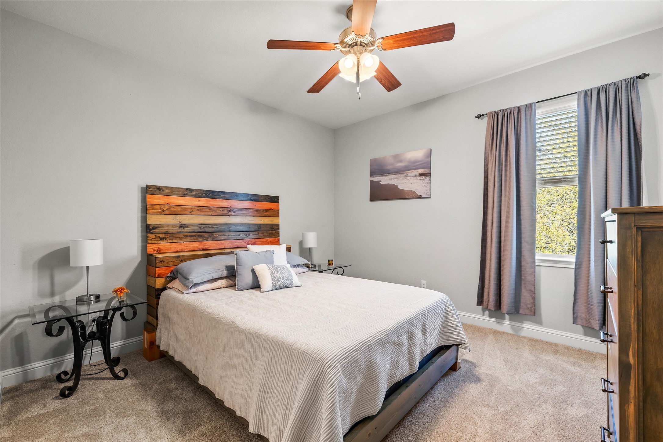 151 Swallowtail Drive Austin, TX 78737 - Photo 24 of 40 a bedroom with a bed and a chandelier