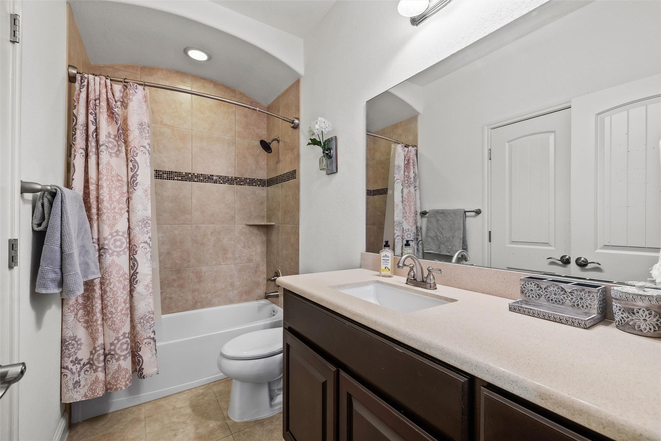 151 Swallowtail Drive Austin, TX 78737 - Photo 26 of 40 a bathroom with a granite countertop sink toilet a shower and a mirror