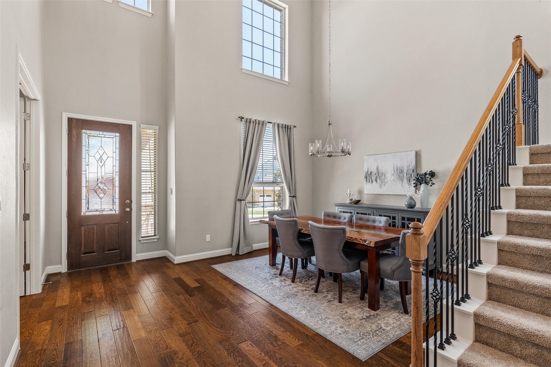 151 Swallowtail Drive Austin, TX 78737 - Photo 3 of 40 a view of a dining room with furniture and wooden floor