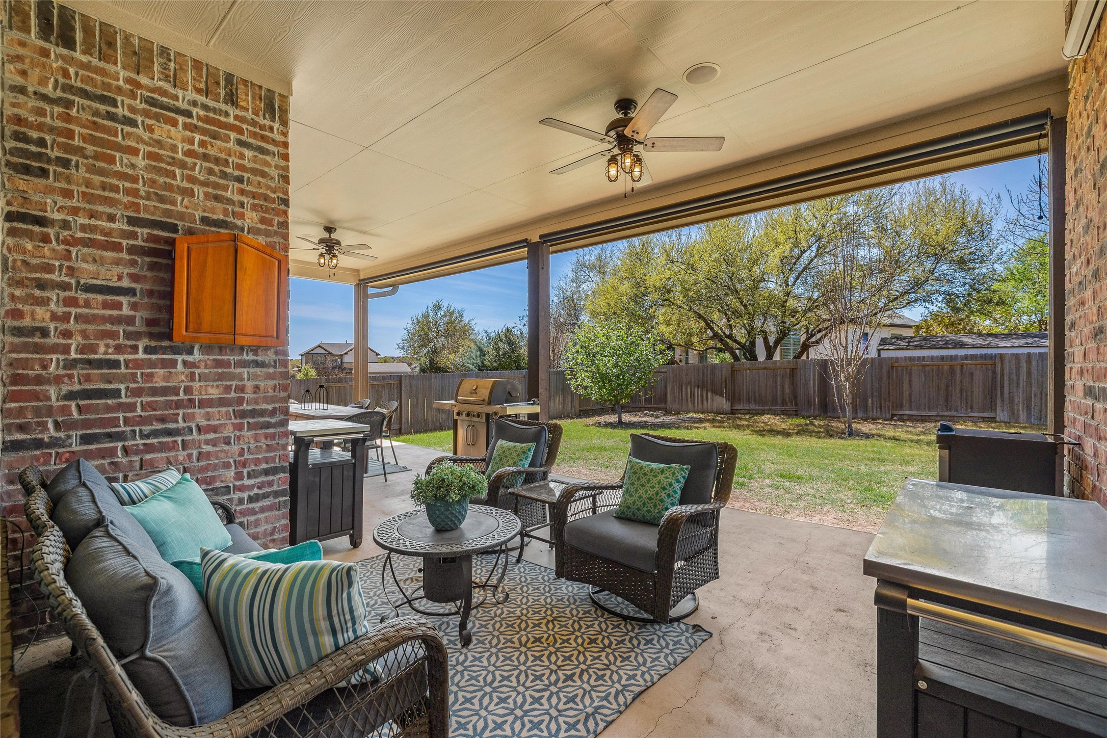 151 Swallowtail Drive Austin, TX 78737 - Photo 31 of 40 a outdoor living space with furniture and a garden