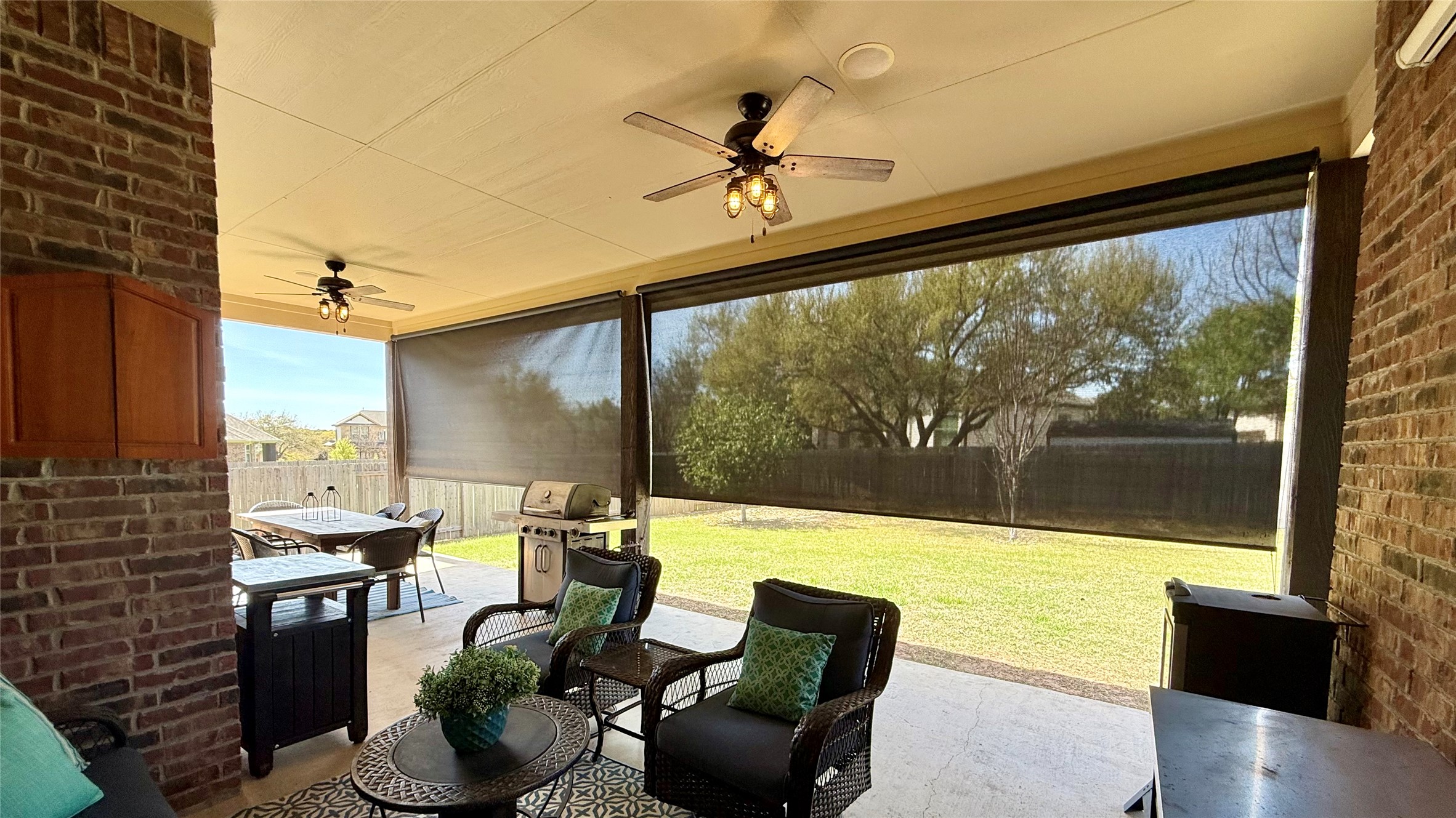151 Swallowtail Drive Austin, TX 78737 - Photo 32 of 40 a living room with furniture and floor to ceiling windows