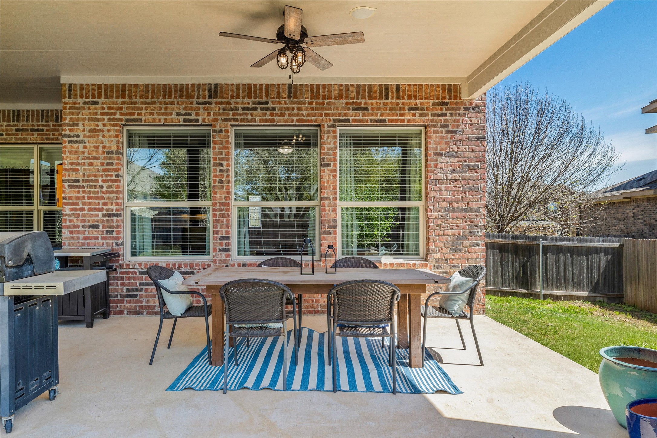 151 Swallowtail Drive Austin, TX 78737 - Photo 33 of 40 a view of a house with backyard and sitting area