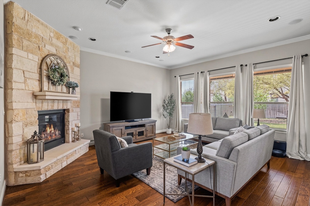 151 Swallowtail Drive Austin, TX 78737 - Photo 5 of 40 a living room with fireplace furniture and a flat screen tv