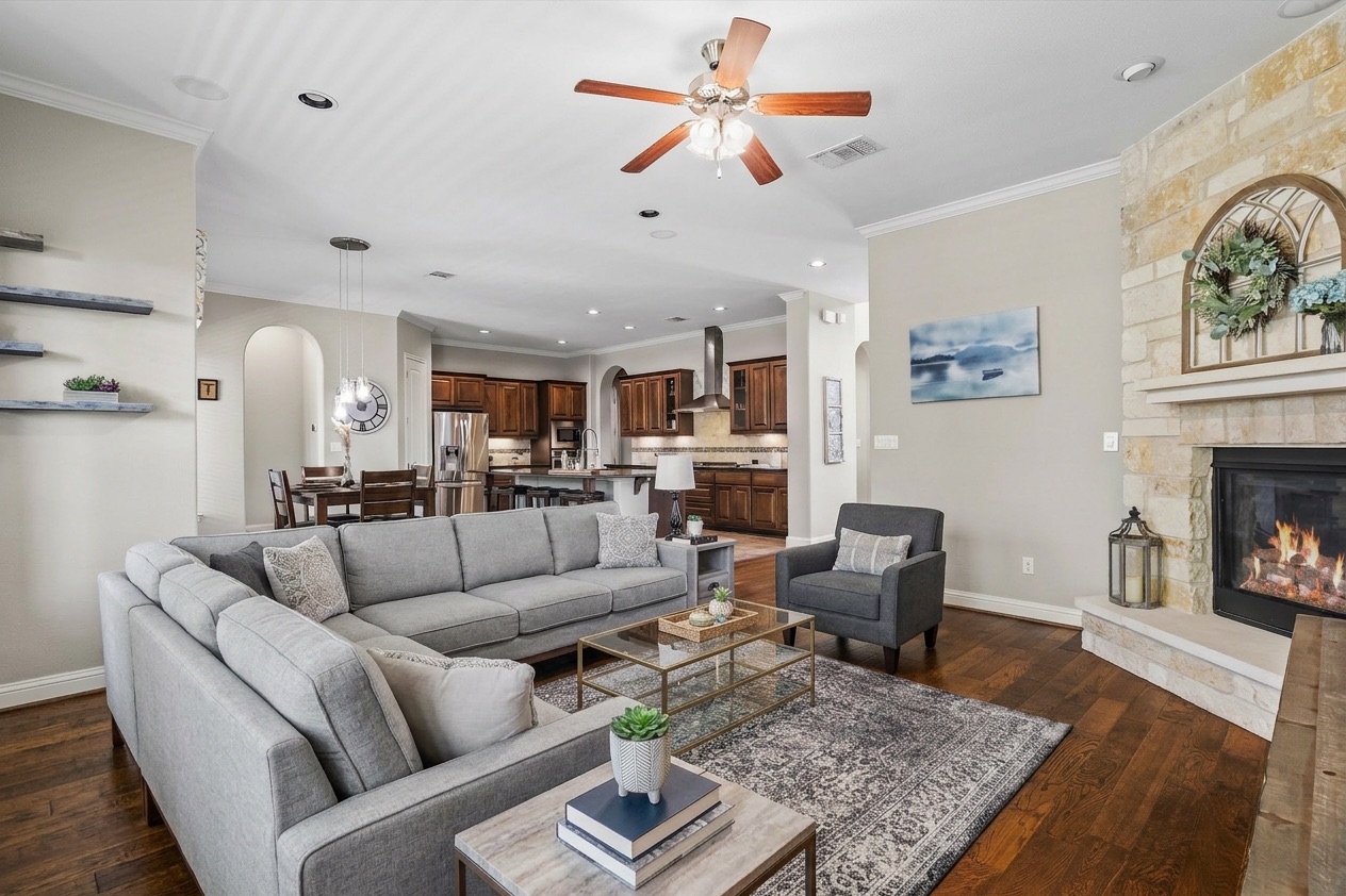 151 Swallowtail Drive Austin, TX 78737 - Photo 7 of 40 a living room with furniture or couch and a fireplace