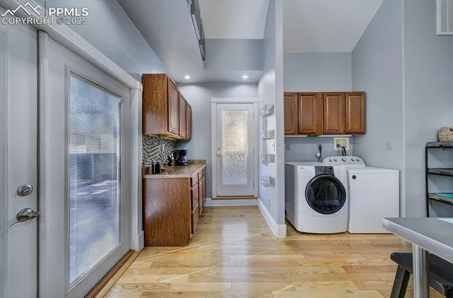 a view of a kitchen with a sink and cabinets