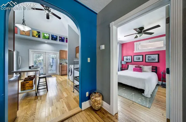 a bedroom with furniture and wooden floor