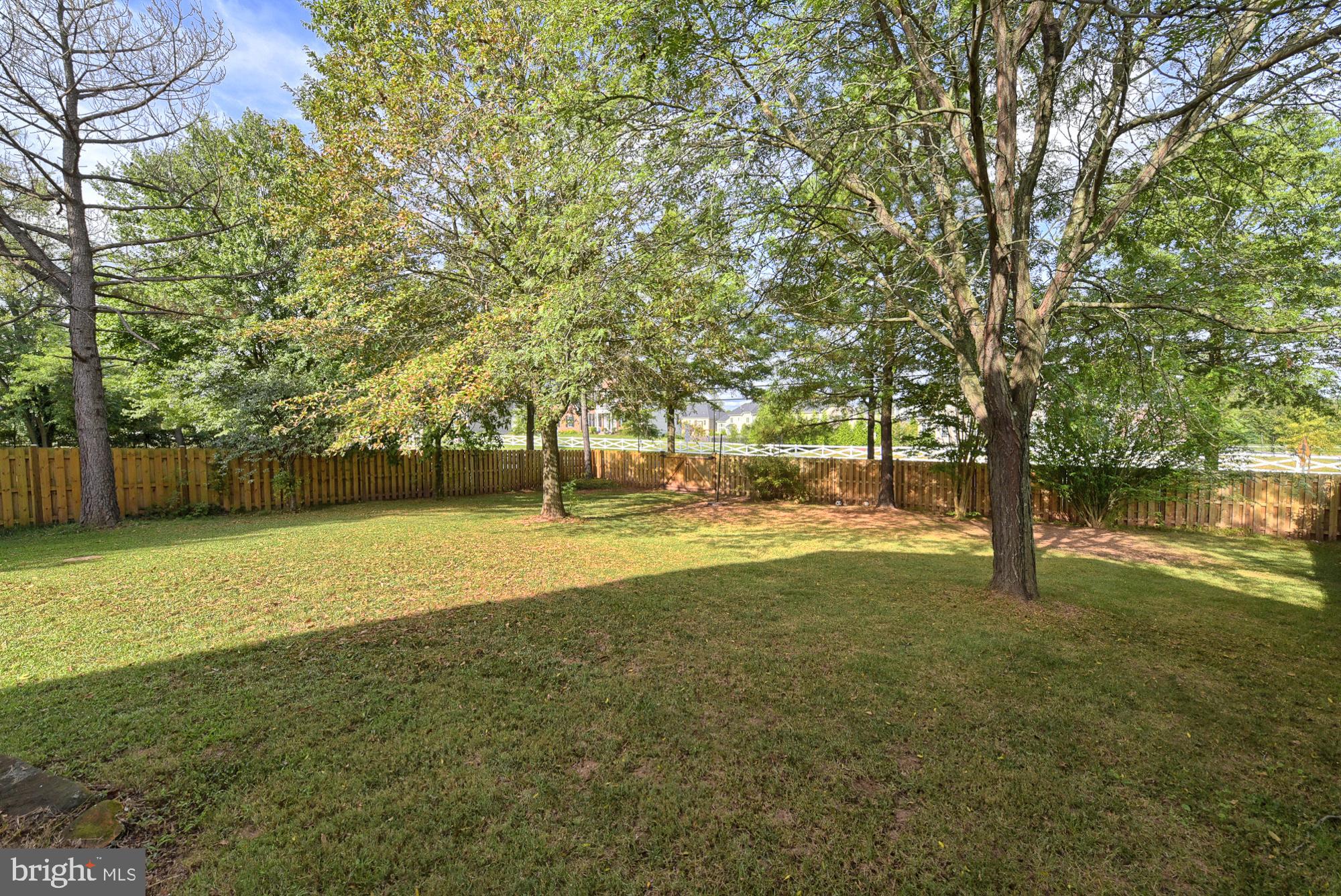 19954 Spurrier Avenue Poolesville, MD 20837 - Photo 11 of 54 Large side and backyard fenced for dogs!