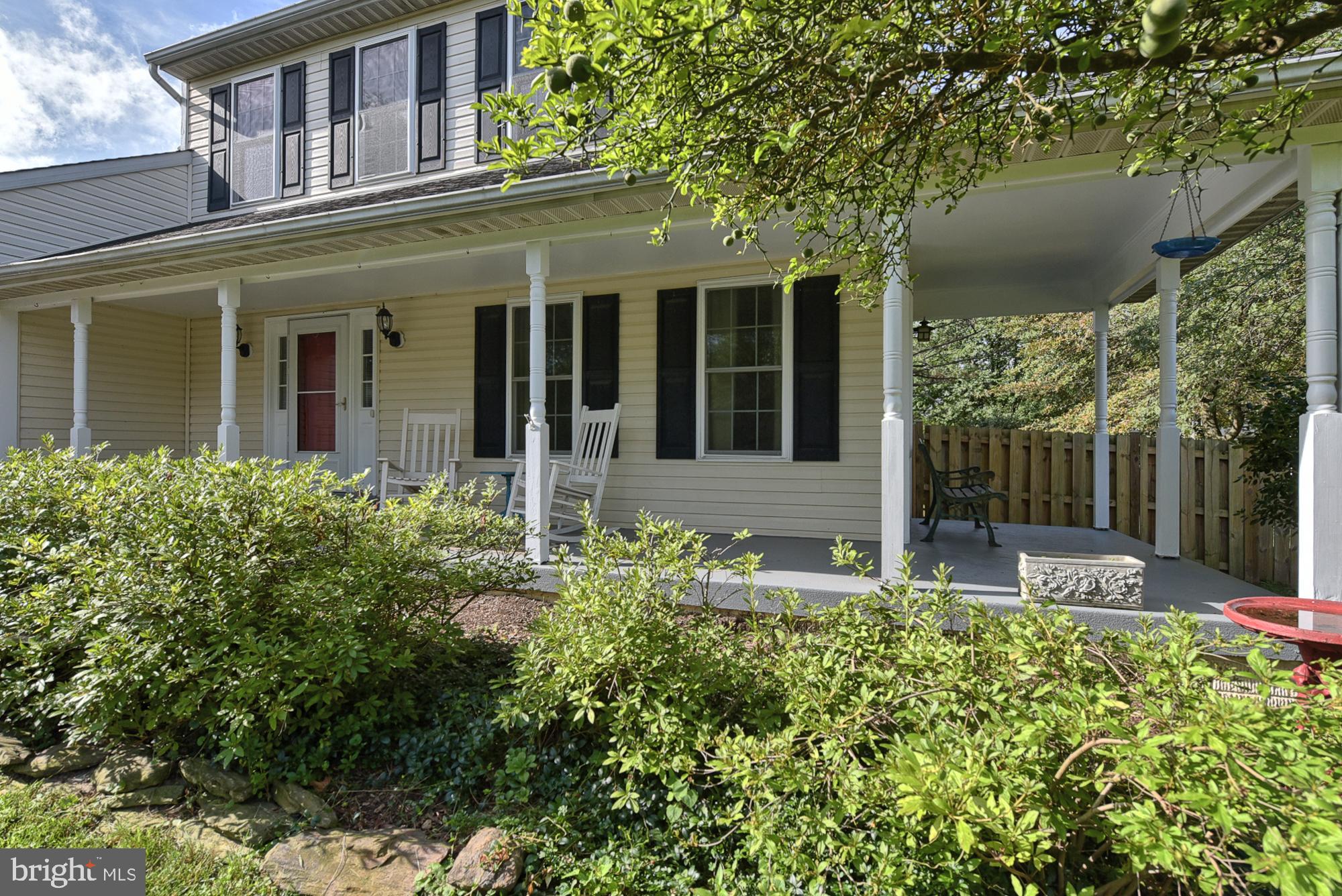 19954 Spurrier Avenue Poolesville, MD 20837 - Photo 8 of 54 Yes, the porch wraps around the side