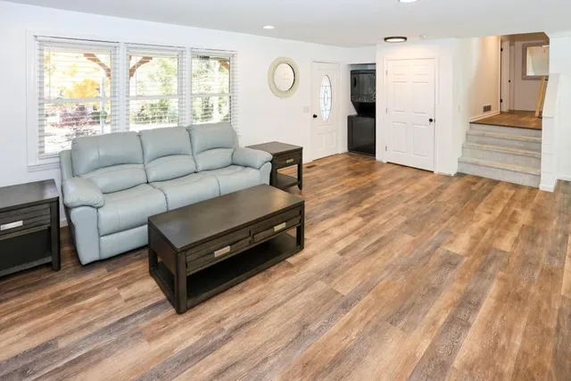 a living room with furniture and a window