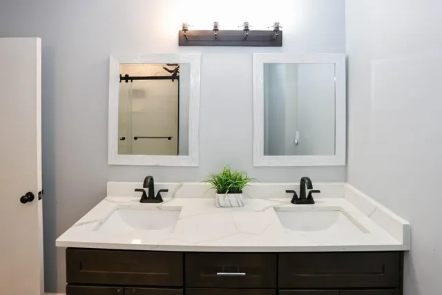 a bathroom with a sink and a mirror