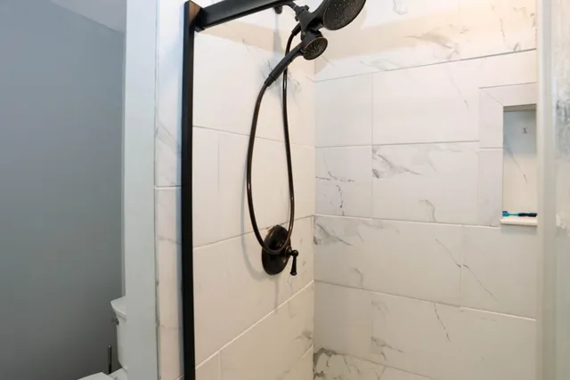 a bed room with a bed and a lamp