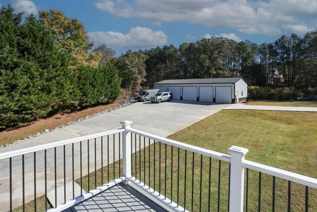 a view of a balcony with wooden floor