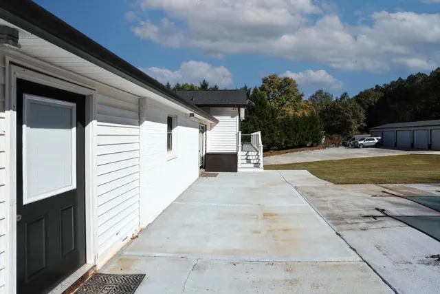 a view of a swimming pool with a yard