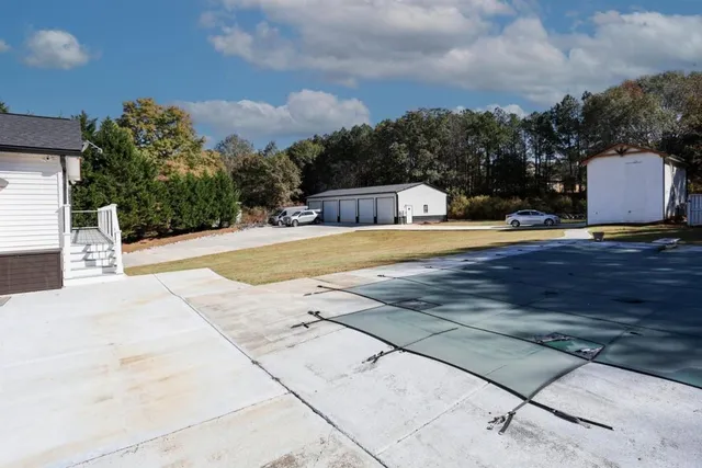 a view of a house with backyard porch and sitting area