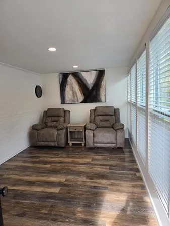 a view of a kitchen with microwave stove and cabinets