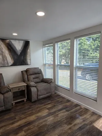 a bedroom with a bed and a night stand