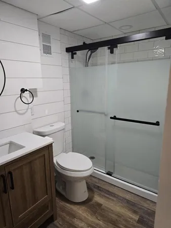 a bathroom with a toilet and a sink