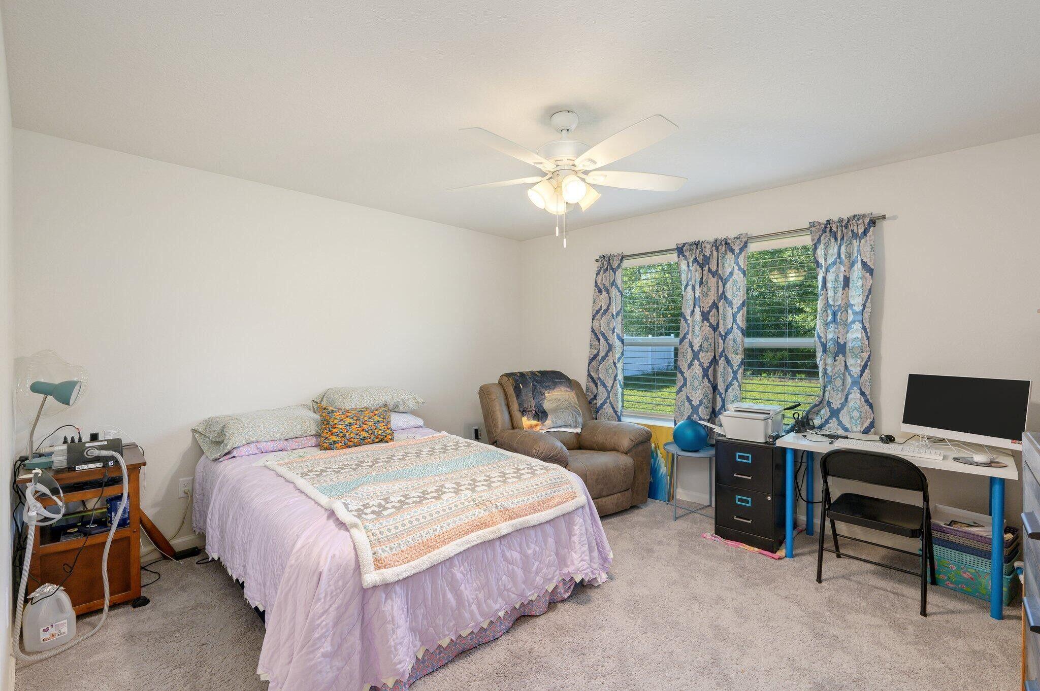 42 Lockwood Way East DeFuniak Springs, FL 32435 - Photo 14 of 38 a bedroom with a bed and a window