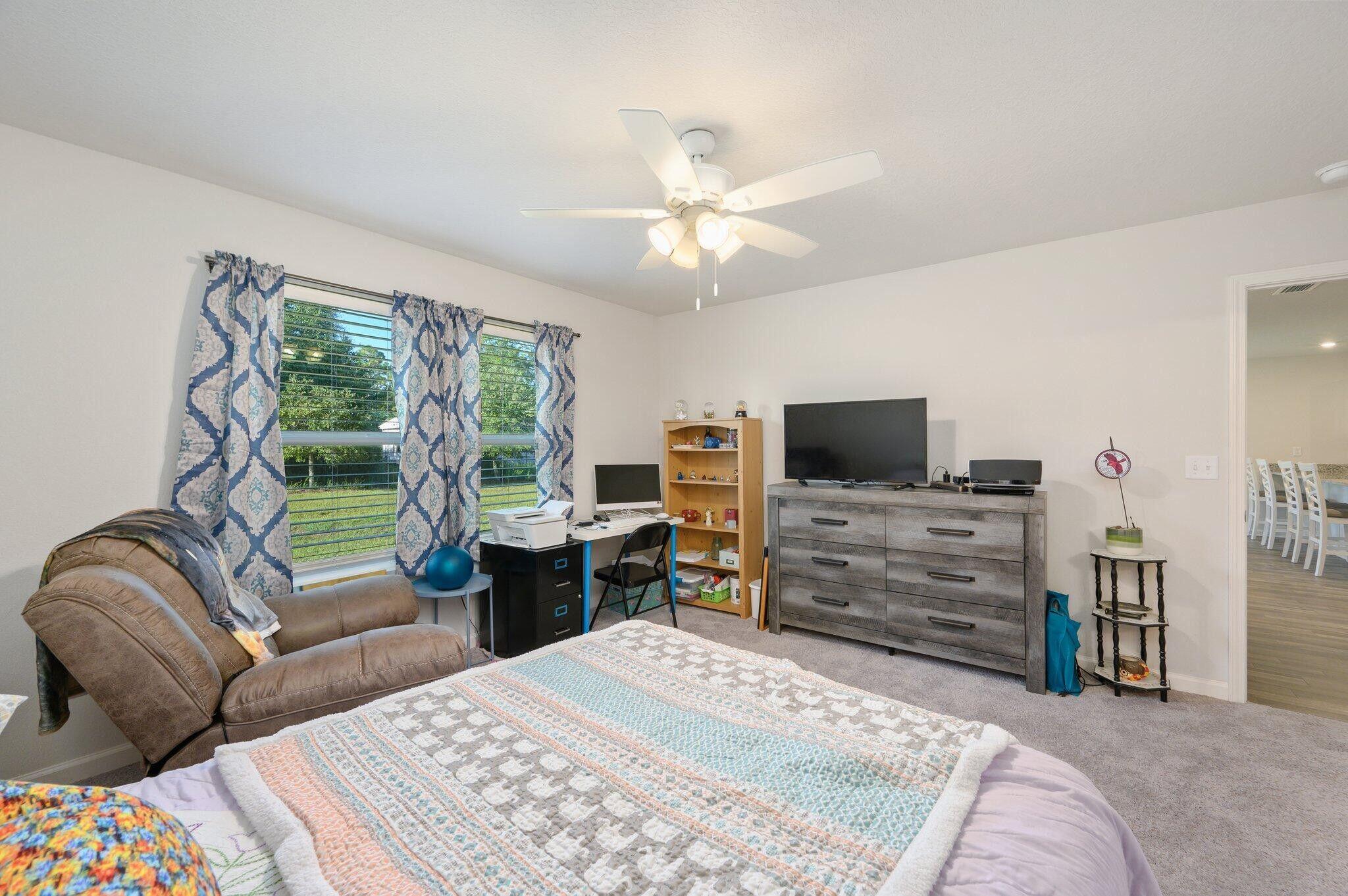 42 Lockwood Way East DeFuniak Springs, FL 32435 - Photo 15 of 38 a bedroom with a bed and a television