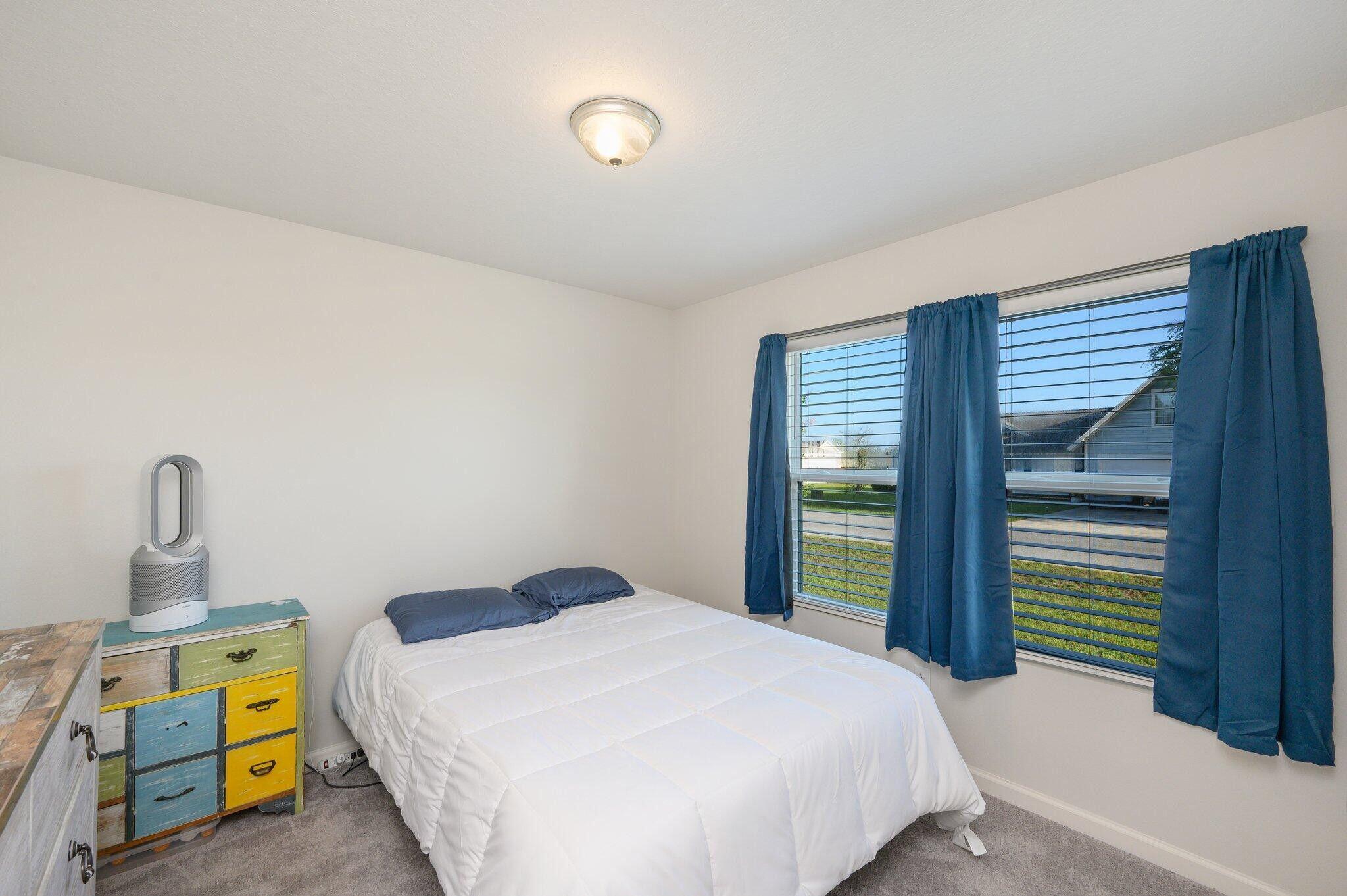 42 Lockwood Way East DeFuniak Springs, FL 32435 - Photo 19 of 38 a bedroom with a bed and a window