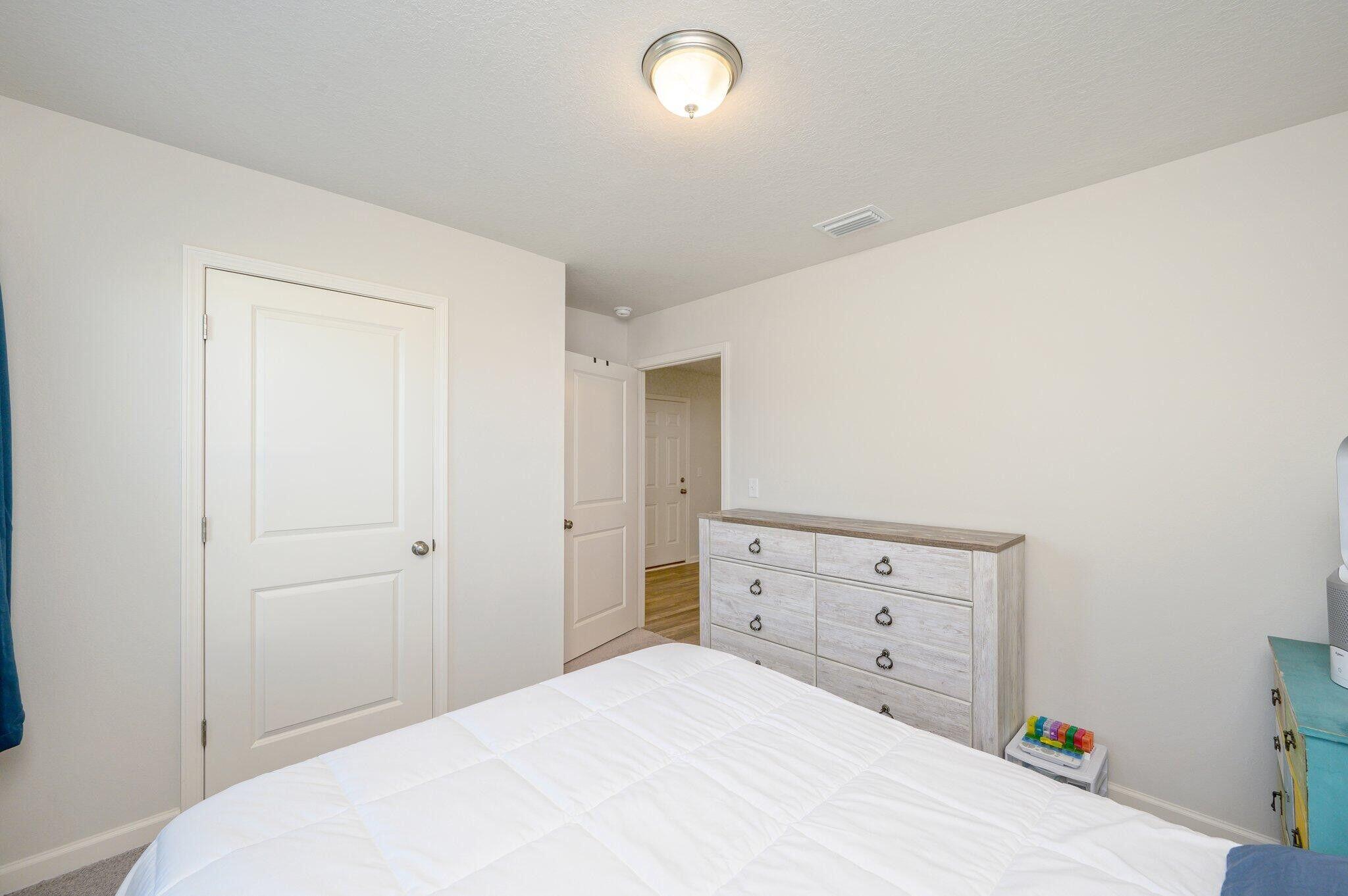 42 Lockwood Way East DeFuniak Springs, FL 32435 - Photo 20 of 38 a bedroom with a bed and a window