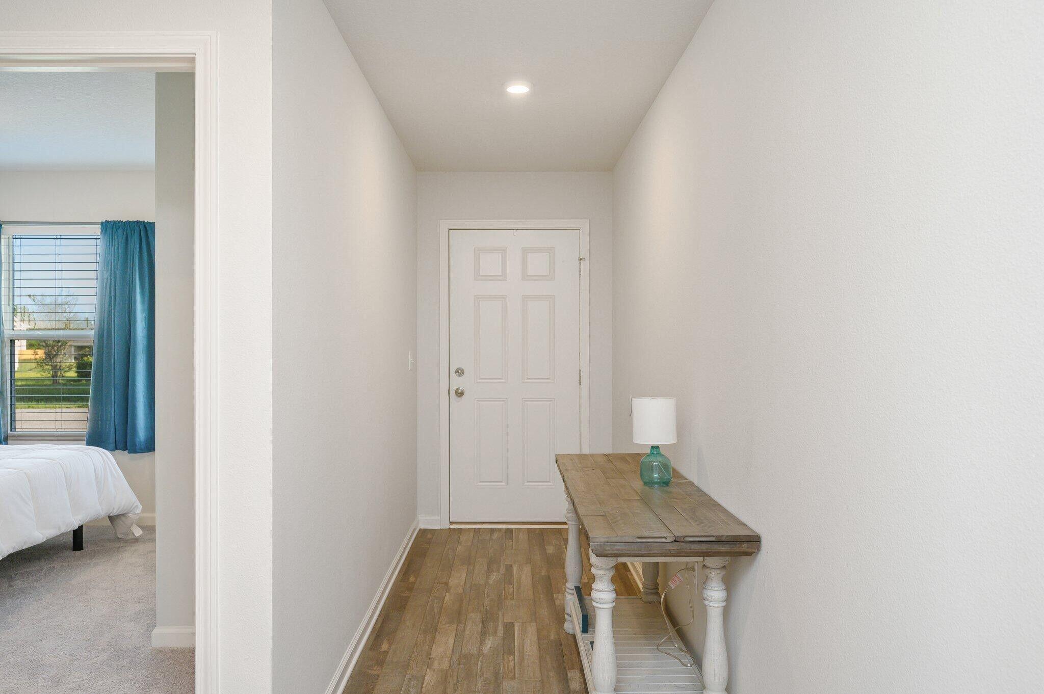 42 Lockwood Way East DeFuniak Springs, FL 32435 - Photo 5 of 38 a room with a bench and a wooden floor