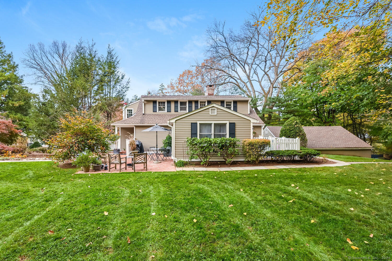 14 Cross Highway, Unit D Westport, CT 06880 - Photo 1 of 1 a front view of a house with a yard