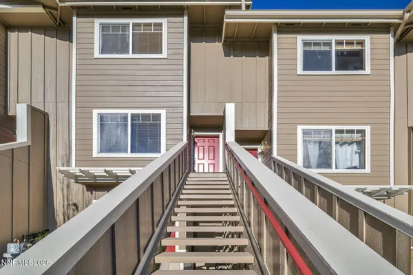 a view of a balcony with wooden floor and staircase