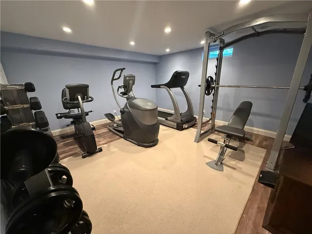 a view of a house with swimming pool and sitting area