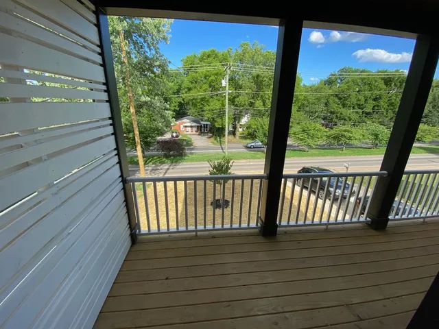 a view of balcony with wooden floor