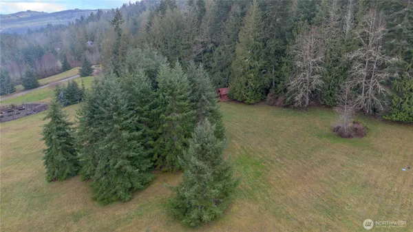 a backyard of a house with lots of green space