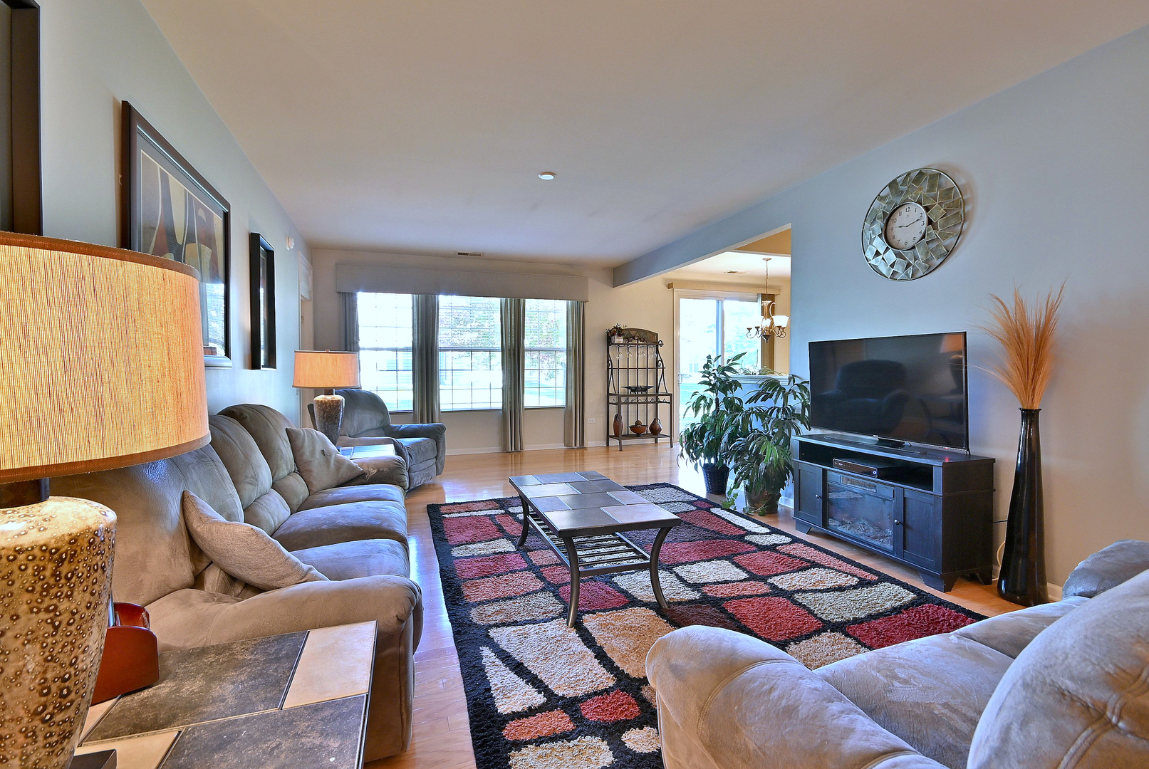 2832 Beacon Point Circle Elgin, IL 60124 - Photo 13 of 36 a living room with furniture and a flat screen tv