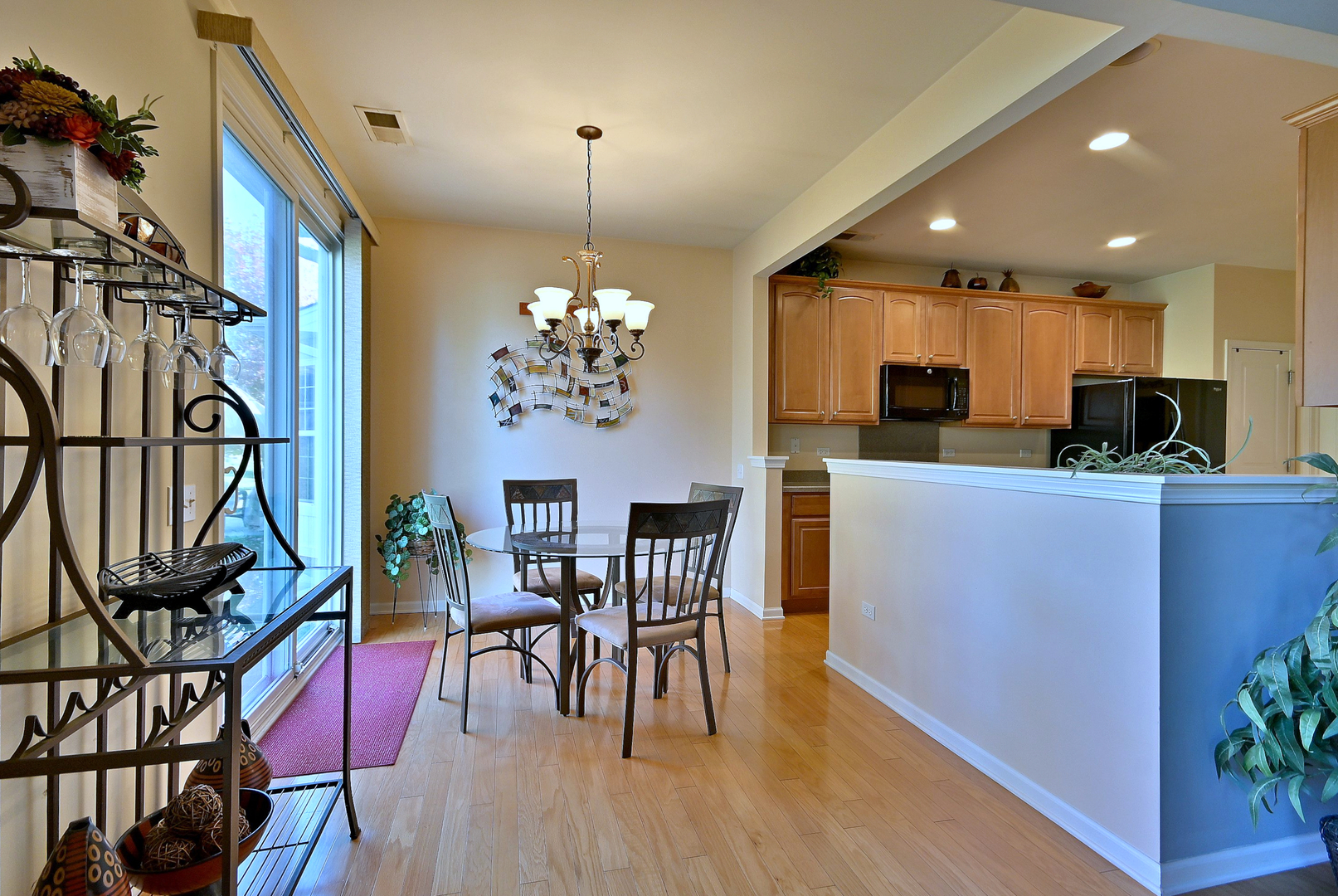 2832 Beacon Point Circle Elgin, IL 60124 - Photo 28 of 36 a view of a dining room with furniture and wooden floor