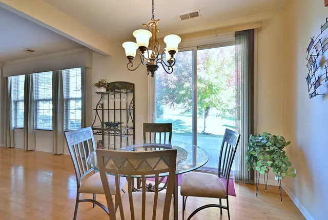 a kitchen with stainless steel appliances granite countertop a refrigerator a stove top oven a sink and dishwasher