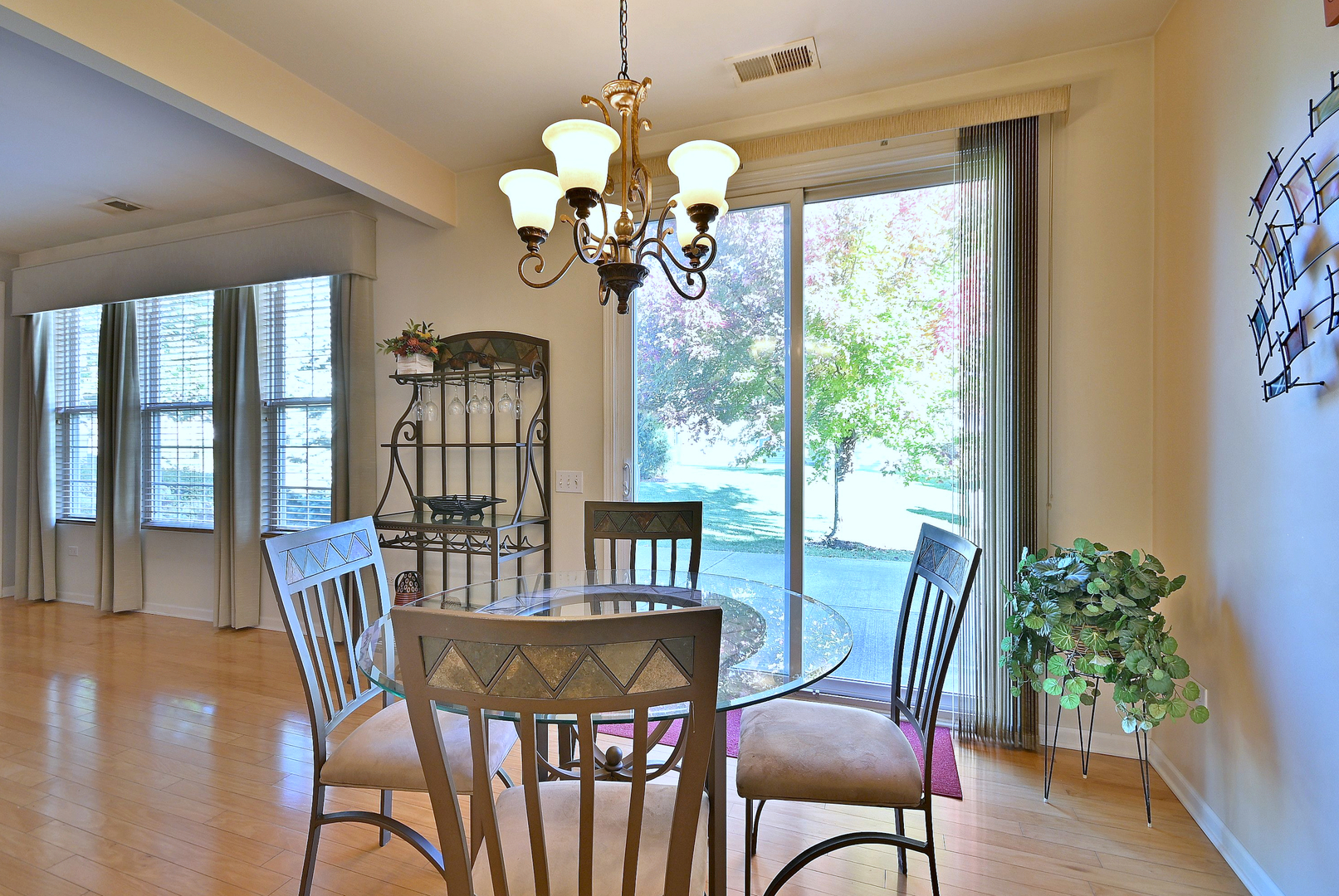 2832 Beacon Point Circle Elgin, IL 60124 - Photo 31 of 36 a view of a dining room with furniture window and wooden floor